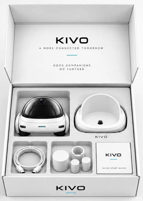 The open KIVO box: robot, charging dock, cable and quick start guide neatly arranged